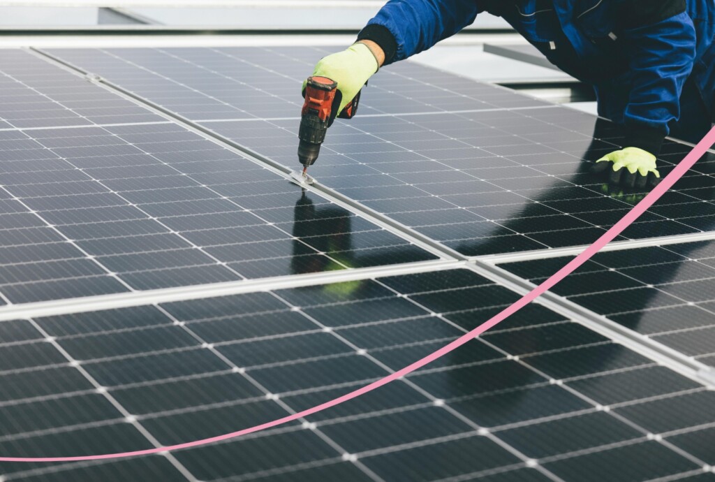 Man installing solar panels